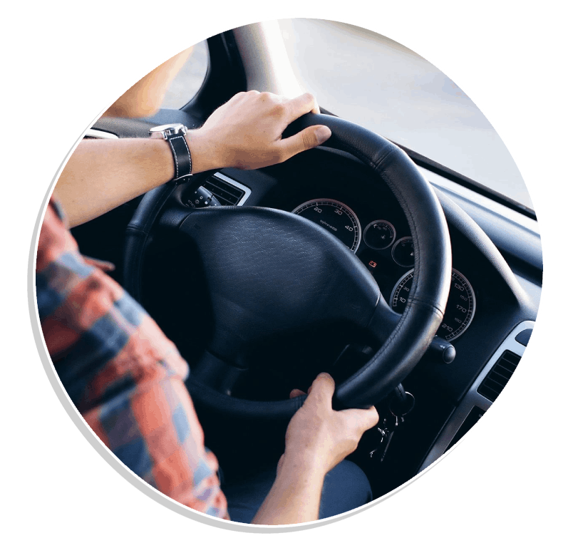 View at young handsome man driving modern car