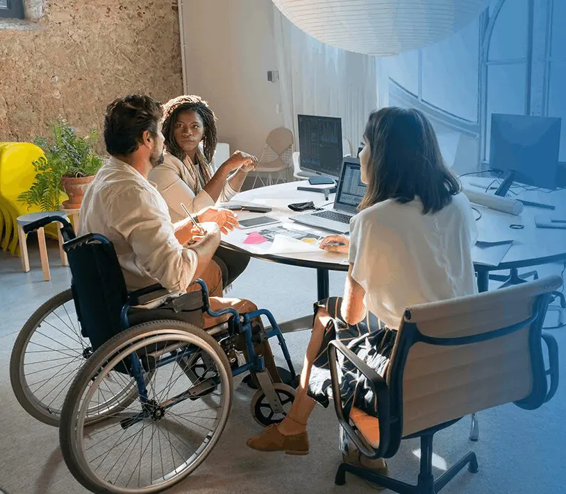 Happy creative man in wheelchair working